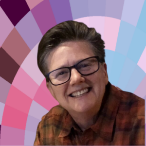 Photo of Karen Cangialosi, a white woman with glasses, short brown hair, and a huge smile.