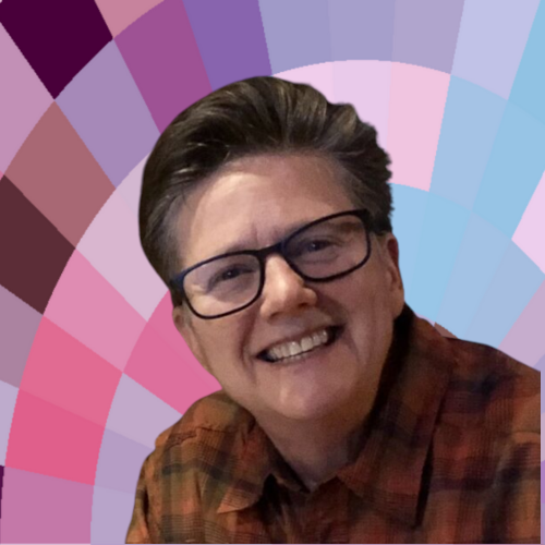 Photo of Karen Cangialosi, a white woman with glasses, short brown hair, and a huge smile.