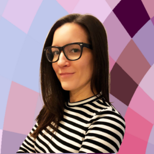 Karen Costa (white woman wearing glasses in black and white striped shirt crossing her arms).