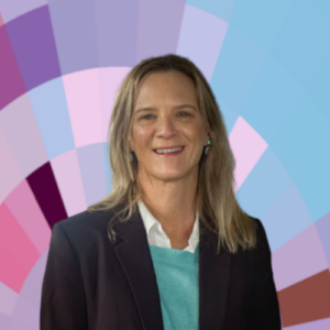 Headshot of Glenda Cox, a smiling white woman with long blonde hair, wearing a white shirt, turquoise sweater, and dark suit jacket, on top of a MYFest background of colorful pink, purple and blue four-sided shapes spiraling out from the center.