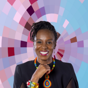Headshot of Ama Wray, a smiling Black woman with curly dark hair worn up wearing a dark dress and colorful necklace and bracelet, on top of a MYFest background of colorful pink, purple and blue four-sided shapes spiraling out from the center.