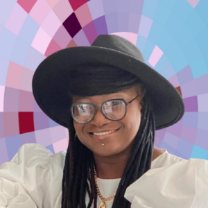 Headshot of Diann Selman, a smiling woman with long, braided dark hair wearing a hat with a wide brim and framed eyeglasses, on top of a MYFest background of colorful pink, purple and blue four-sided shapes spiraling out from the center.